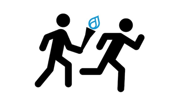 One stick figure passing a torch with a flame in the shape of the Drupal logo to another stick figure.